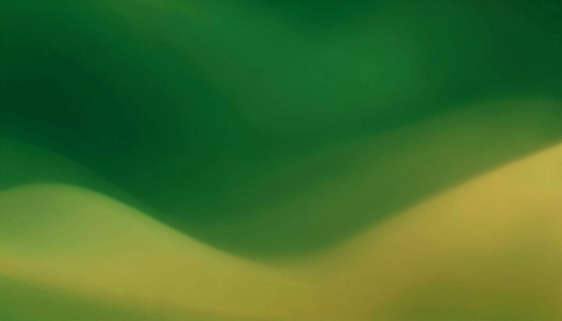 Abstract gradient composition in deep green and golden hues, evoking alpine meadows